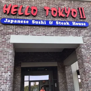 Outside the restaurant + some random people who PHOTOBOMBED my pic! Ugh...so rude.