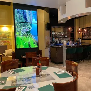 a restaurant with a large screen