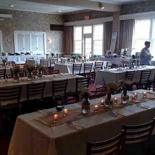 a dining room with tables and chairs