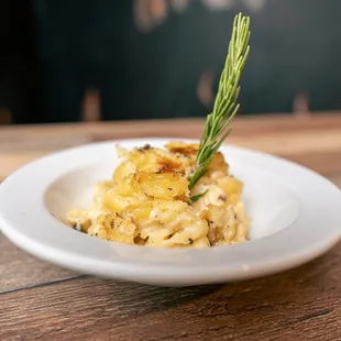 a plate of food on a wooden table