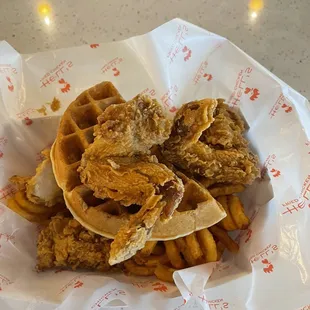 a basket of fried chicken and waffles