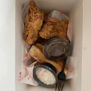 coleslaw/sauce in containers, toast, chicken, fries on bottom!