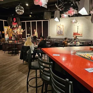a restaurant with red counter tops