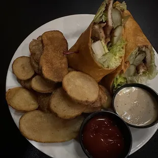 a plate with a sandwich and chips