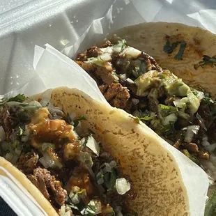 Al Pastor &amp; Birria tacos made on fresh tortillas.