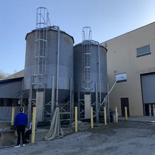 a man standing in front of a building