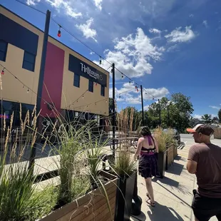 people walking down the sidewalk