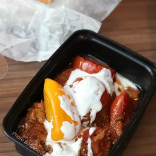 Banjan Borani ($5.50) - Pan-fried eggplant seasoned with fresh tomatoes spice baked and served on yogurt garlic sauce