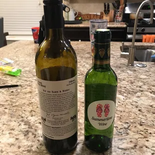 Left bottle is a regular sized wine bottle. I used in the picture for comparison. A bottle of Summertime wine costs $8.