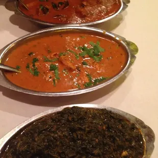 Lamb vindaloo , chicken masala , and sag paneer