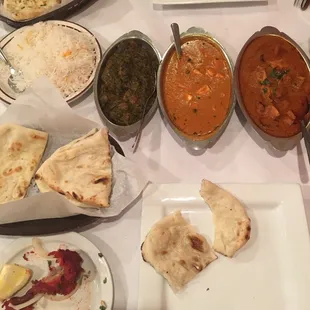 Dishes in the middle, left to right, are Saag Gosh, Shahi Paneer, Chicken Vindaloo.