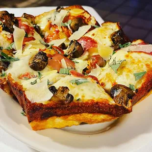 Our "Roma" with Mushrooms, Fresh Sage, shaved capicola and four cheeses