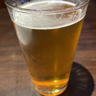 a glass of beer on a table