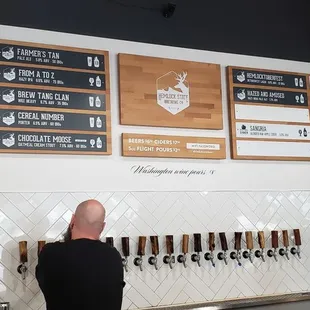 Current beer and ciders on tap as of 7/16/2022. Their beer handles were a pretty cool touch!