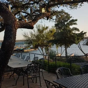 tables and chairs overlooking the water