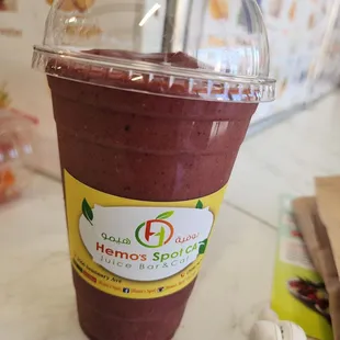 a smoothie in a plastic cup