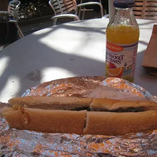 a hot dog and a soda on a table