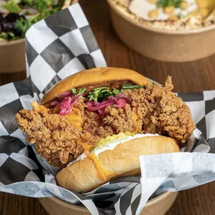 a fried chicken sandwich in a basket