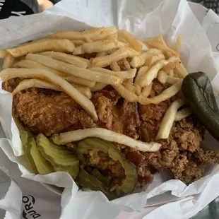 a basket of fried chicken and french fries