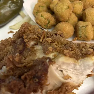 Burnt chicken breast with fried okra.