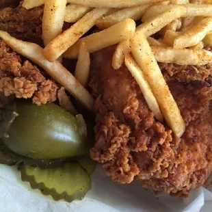 a basket of fried chicken and french fries