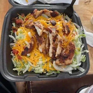 chicken, lettuce, and cheese in a pan