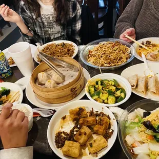 Soup dumplings chicken with broccoli, crispy tofu with minced pork seafood pan fried noodles and seven spices noodles I think