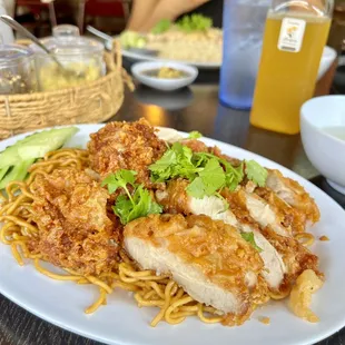 half fried chicken and fried pork with garlic noodles