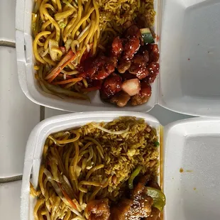 two take out containers of food