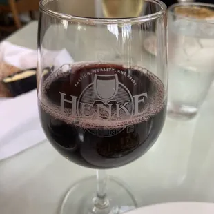 a glass of wine on a table