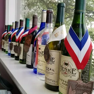 Wine bottles lining the window.