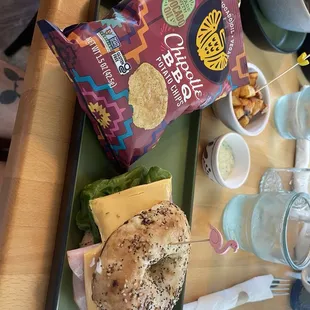 Building your own sandwich with chips and side of potatoes