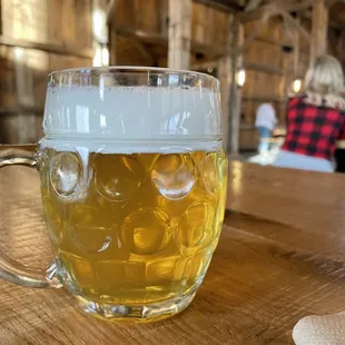 A frosty beer while sitting inside