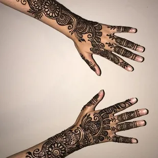 Bridal henna on the back of hands
