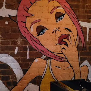 a woman with pink hair and blue eyes