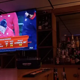 a man watching a baseball game on tv