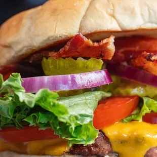 a bacon, lettuce, tomato, and cheese sandwich