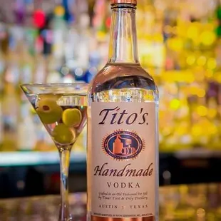 a martini and a bottle of handmade vodka