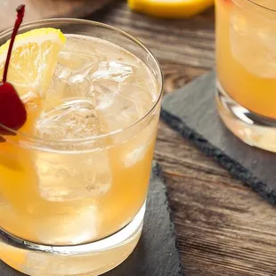 a close up of two glasses of lemonade