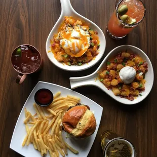 three plates of food including a burger and fries