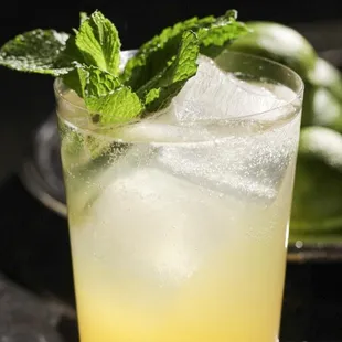 a glass of lemonade with mint