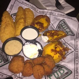 Pub combo spicy fried pickles, chicken fingers, loaded potato skins and of course a Guinness to wash it all down.