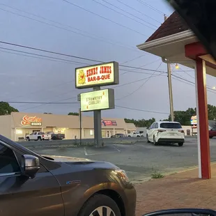 a car parked in front of a restaurant