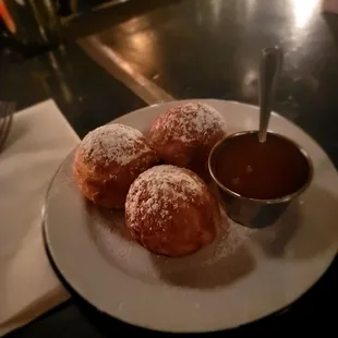 Wilkinson&apos;s- Their ebelskivers a Dutch dessert (cross between a pancake and donut) served with a rum and caramel sauce. Half order.