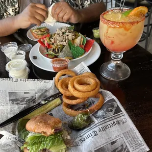 Fat Jesse burger, onion rings, nachos and Paloma.