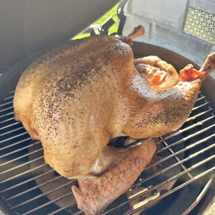 a whole chicken on a grill