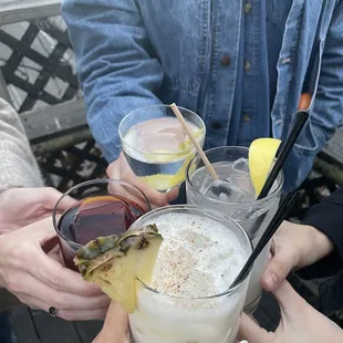 a group of people holding drinks