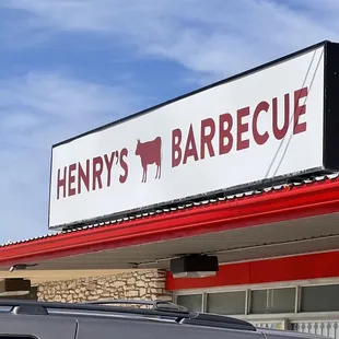 Henry&apos;s BBQ sign on building