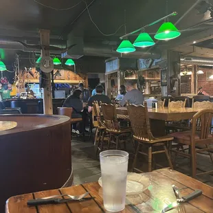 a man sitting at a table with a glass of water