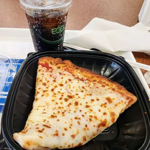 Piece of cheese pizza and a diet Pepsi . Grabbing lunch and resting legs